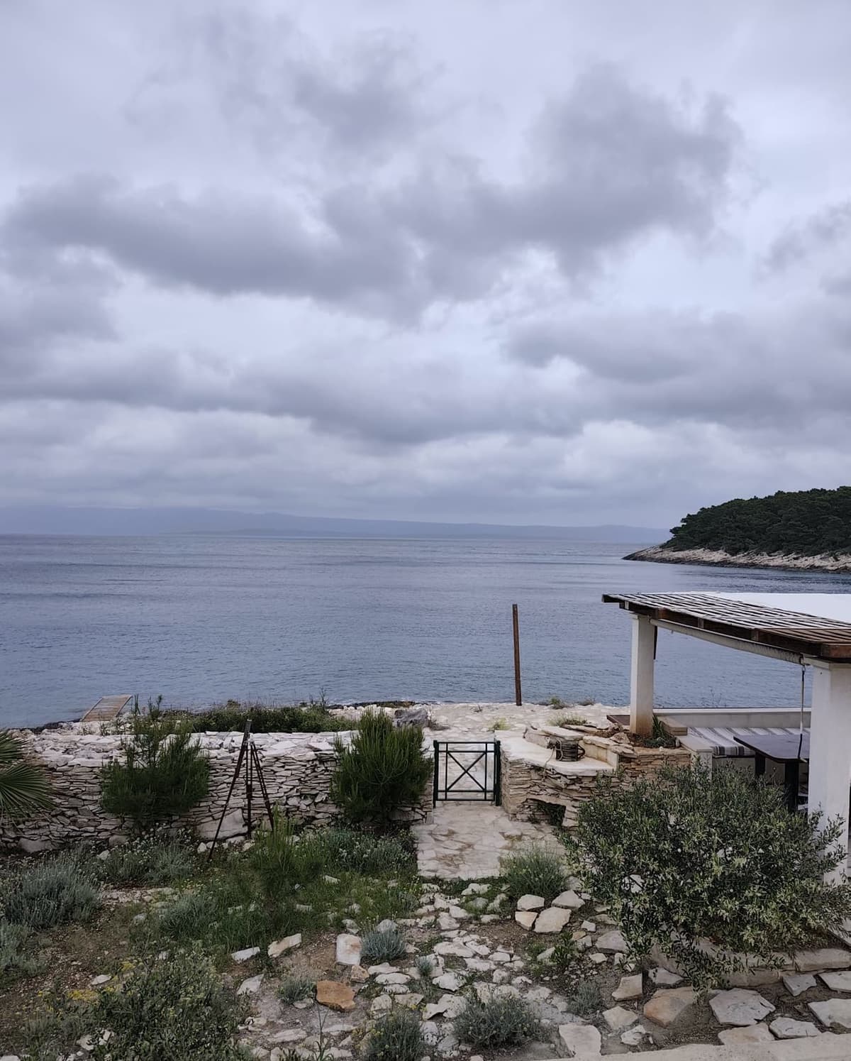 Open sea view over the garden wall