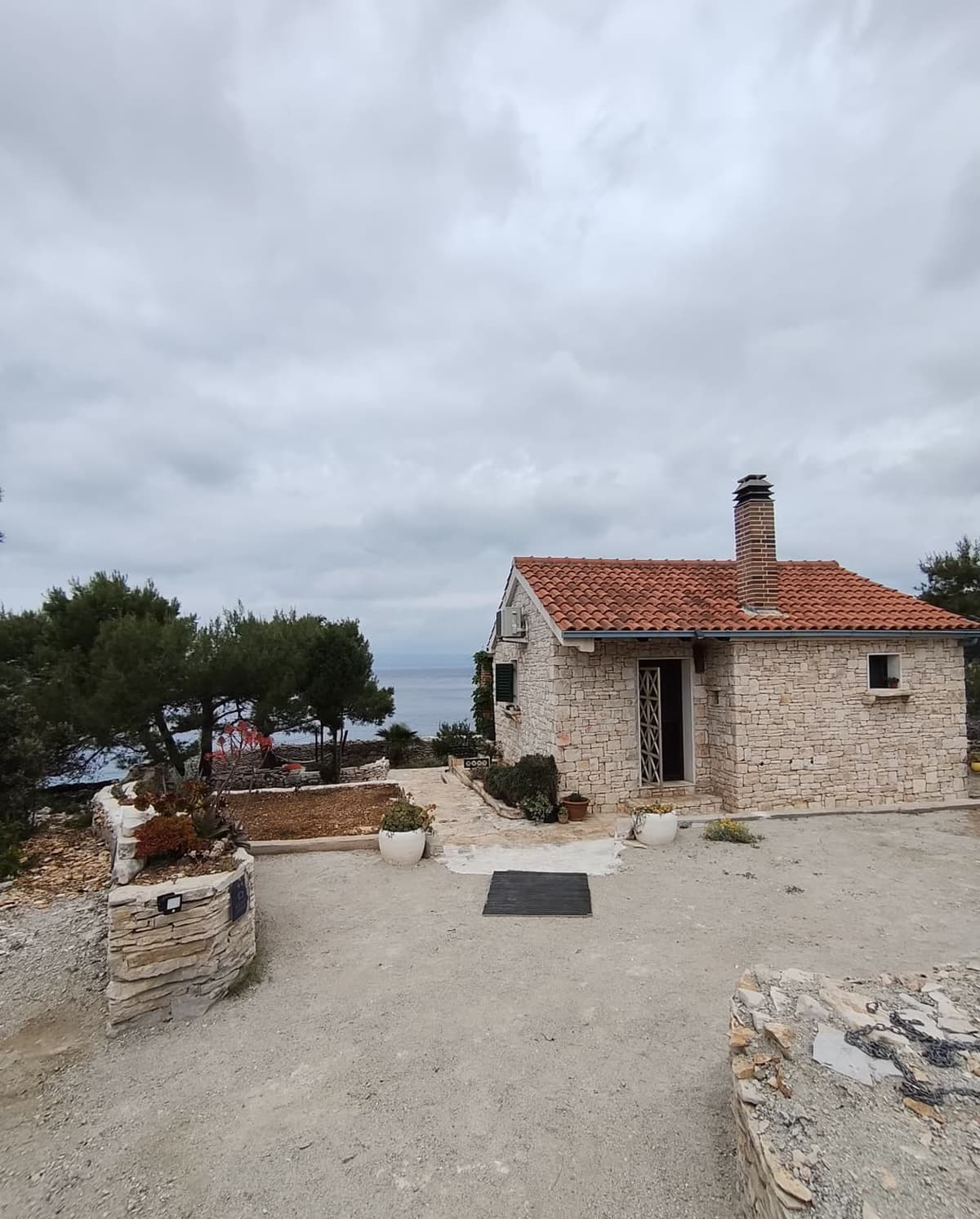 Stone house with sea backdrop