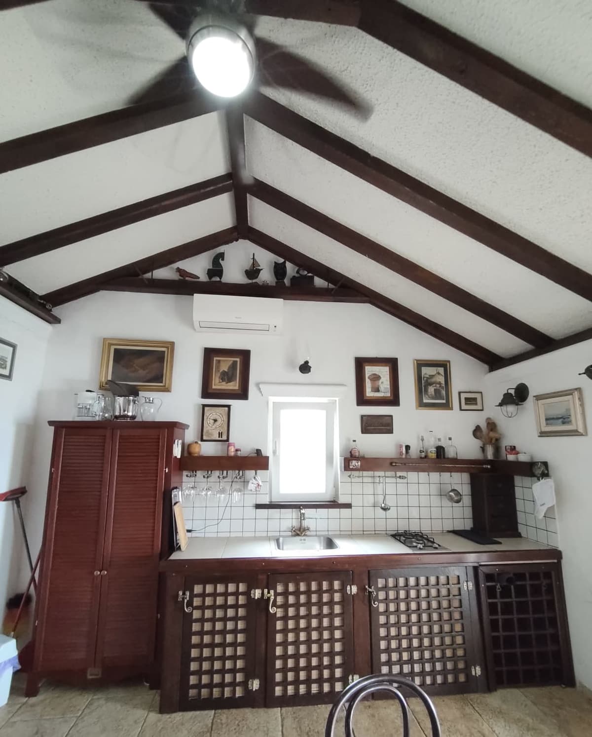 Kitchen under the vaulted wood ceiling