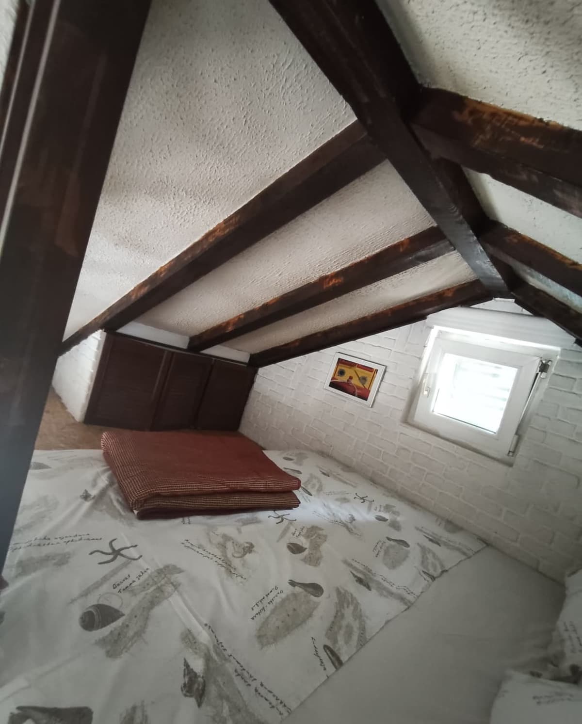Dining space with fan and pitched ceiling