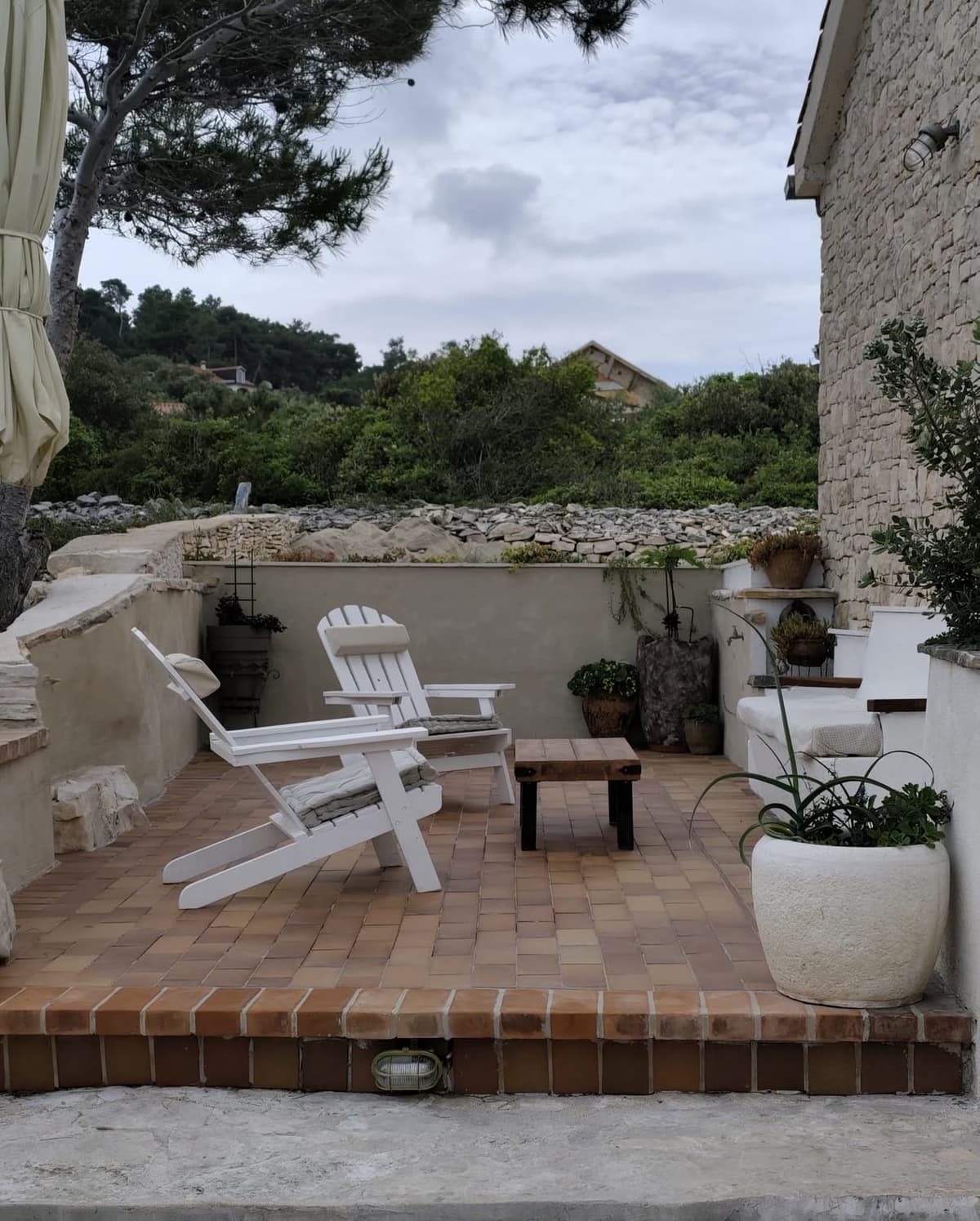 Quiet terrace nook with white seating