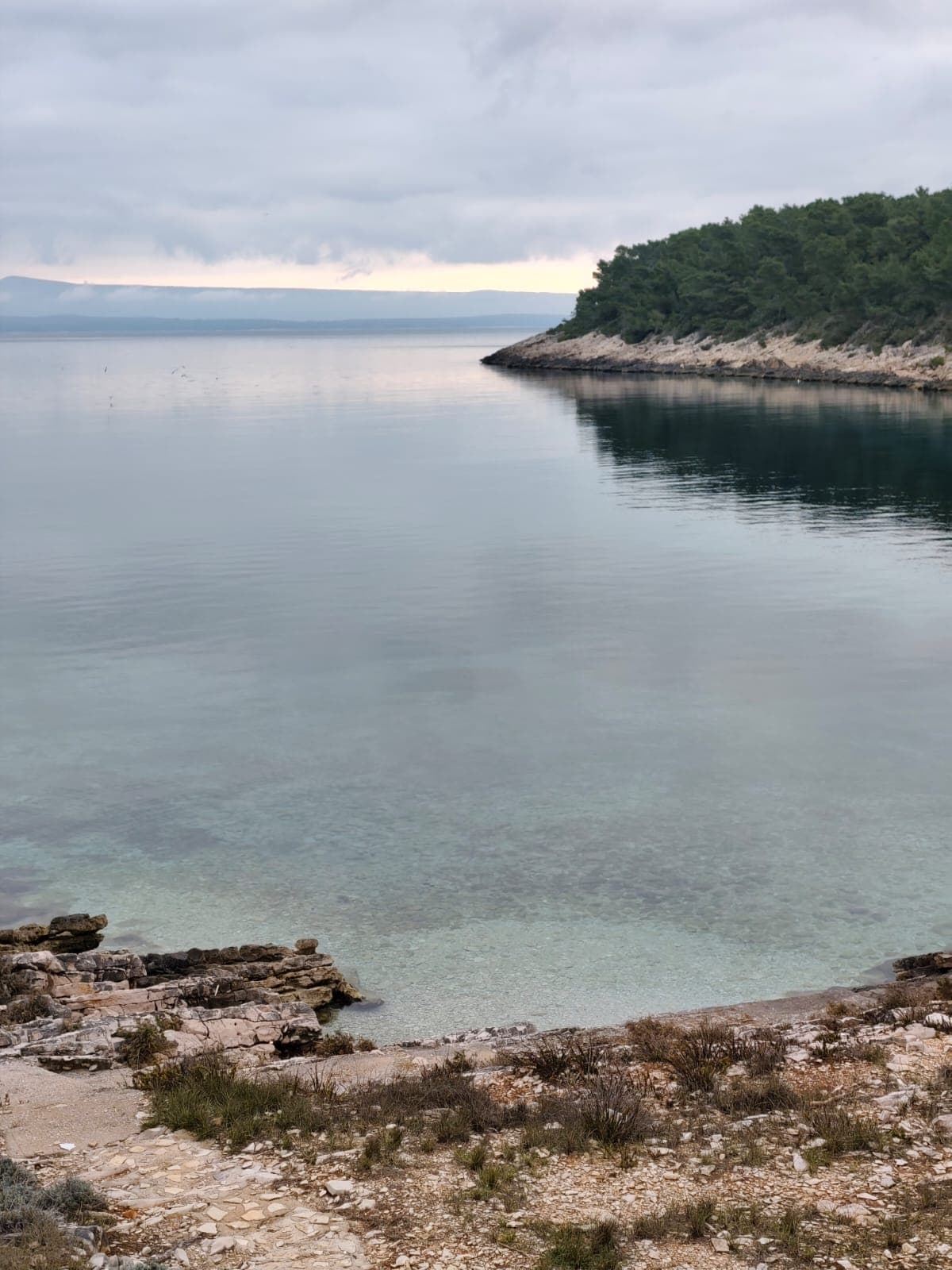 Clear water with distant hills