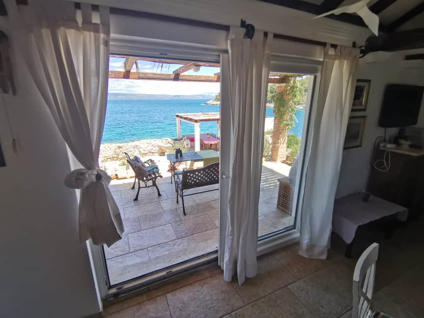 Open door to terrace with sea view