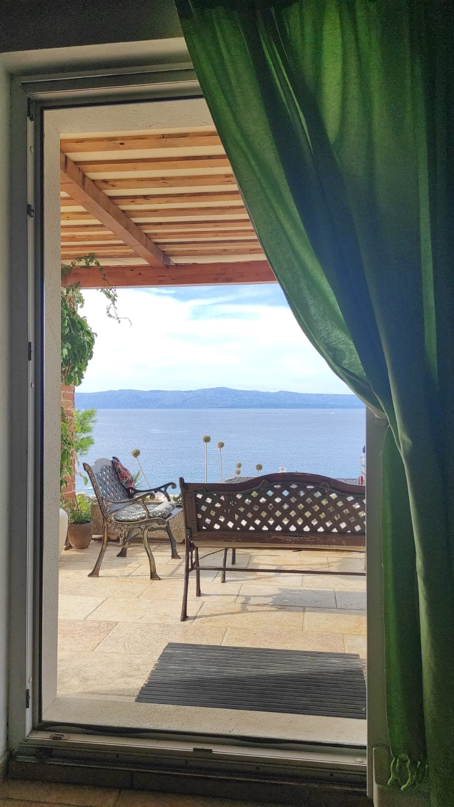 Terrace sea view through curtain